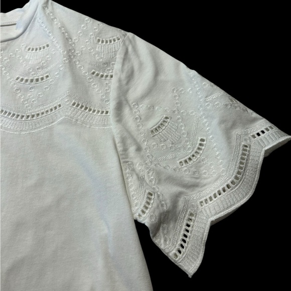 An Ophelia Roe short sleeved white pullover blouse with top and sleeve eyelets - Picture 5 of 8